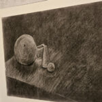 Black and white sketch of spheres on table. Created by Alexis- Recipient of a Nellie Leaman Taft Foundation.